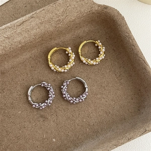 French style twisted pearl hoop earrings set in gold and silver finish with retro design