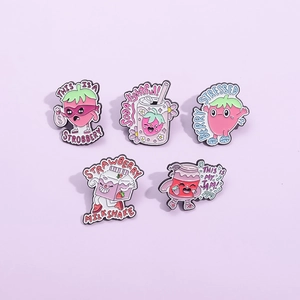 Set of five cute strawberry enamel pins with funny puns on a purple background