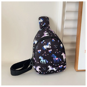 Detail of kids black crossbody bag featuring colorful unicorn prints and zip closure