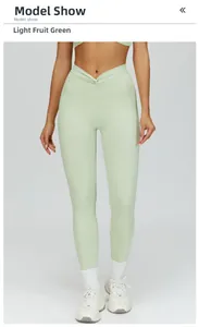Detail of high waist yoga leggings with V-shaped cross pleated waistband in light fruit green