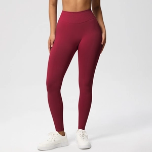 Detail showing the burgundy high-waisted seamless yoga pants with peach lift effect
