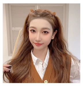 Close-up of brown jelly-colored claw clips on long wavy hair for half-up hairstyles