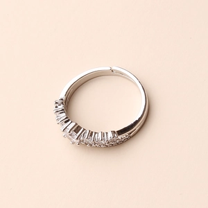 Macro shot of silver adjustable open ring with sparkling pavé cubic zirconia inlay