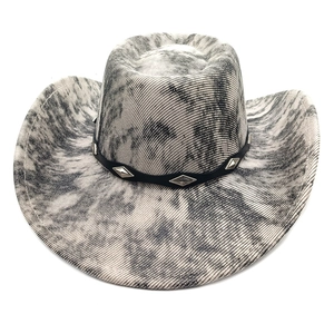 Detail of western cowboy hat with grey marble pattern and silver studded leather band