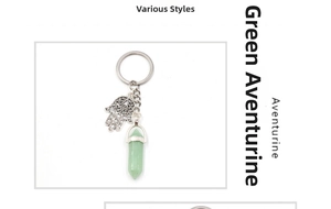 Detail of Hamsa Hand charm with a hexagonal Green Aventurine crystal pillar keychain