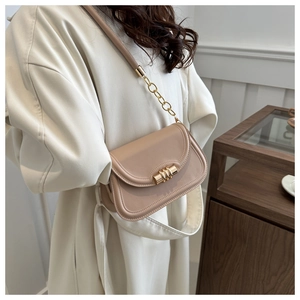 Minimalist half-moon shoulder bag in milk tea brown with gold chain strap detail