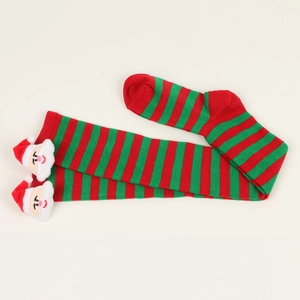 Close-up of red and green striped Christmas stockings with 3D plush Santa Claus doll detail