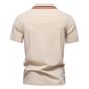 Detailed back view of beige polo shirt showing piqué cotton texture and striped collar