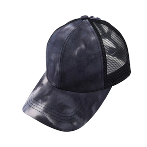 Close-up of tie-dye fabric and breathable mesh detail on the back of the baseball cap