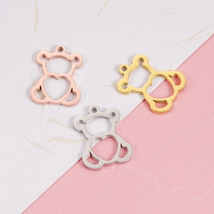 Three hollow bear pendants in rose gold, gold, and silver on a bicolor background