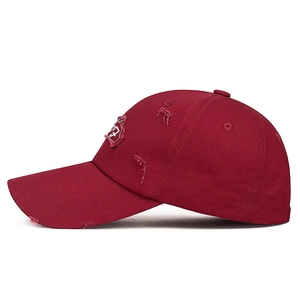Distressed burgundy baseball cap with letter patch and vintage ripped details for outdoor wear