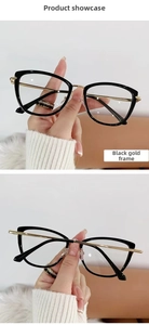 Detail shot of black and gold cat-eye glasses frame with metallic temples and bridges