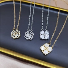 Detail of clover necklaces with crystal inlay and shell texture on a display tray