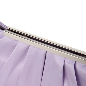 Detailed macro view of purple pleated satin fabric with silver metal frame and clasp