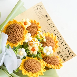 Detailed macro view of a handmade crochet sunflower bouquet with an elegant decorative card
