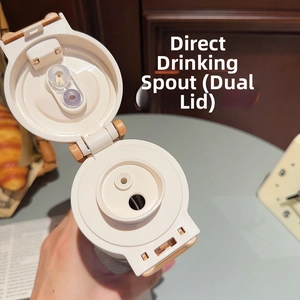Detail view of the cream lid with dual drinking system for the leopard print tumbler