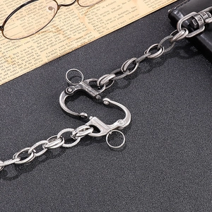 Macro detail of retro stainless steel chain with industrial clasp and vintage finish