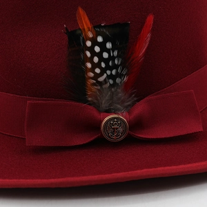 Classic burgundy wool fedora hat with a colorful feather accent and bronze buckle