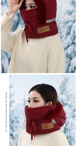 Close-up of the burgundy winter hood featuring soft faux fur trim and protective face mask