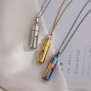Three minimalist stainless steel perfume bottle pendant necklaces in silver, gold, and purple