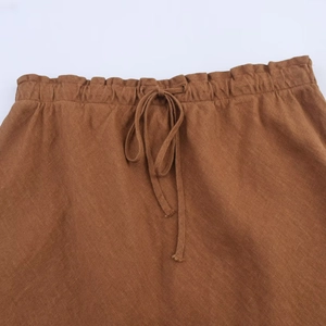 Caramel brown minimalist midi skirt with adjustable drawstring waist and linen texture
