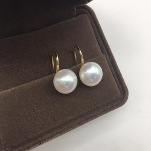 Elegant gold freshwater pearl drop earrings presented in a luxury brown velvet jewelry box