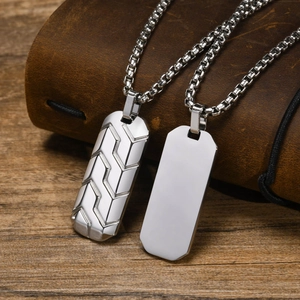 Macro view of geometric tire pattern on stainless steel military dog tag necklace