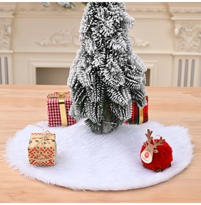Detail of white plush Christmas tree skirt with fluffy texture and wooden base