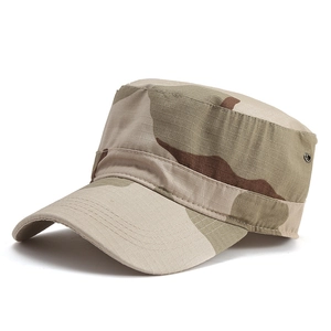 Detail of desert camo flat top military hat with breathable metal eyelets on fabric