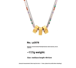 Double-layer gold necklace with colorful zircon stones and three ring pendants detail