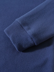 Detailed view of the navy blue polar fleece cuff with high-quality stitching and texture