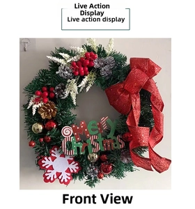 Front view of pine needle Christmas wreath with red bow, pine cones and berries