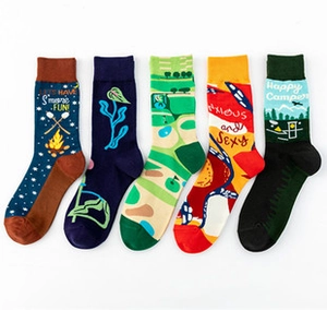 Detail of five crew socks featuring embroidered camping and novelty jacquard patterns
