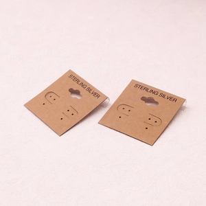 Brown paper earring display cards for Sterling Silver jewelry with hanging hooks