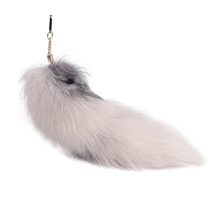 Oversized white fox fur tail keychain with gray tip and golden metal clip for bags