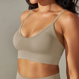Detailed texture of seamless knitted sports bra with thin straps and ribbed band