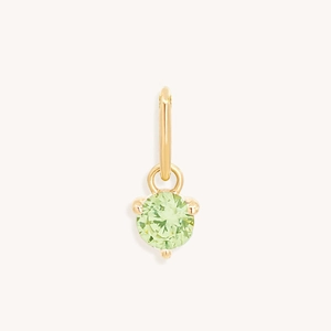 Macro shot of green round cubic zirconia birthstone pendant in 18k gold-plated setting