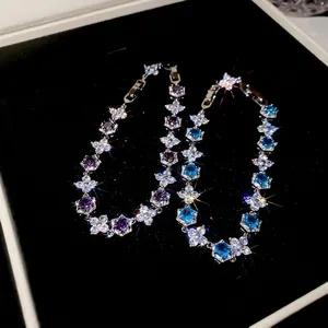 Exquisite flower zircon bracelet with purple and blue stones in a silver chain setting