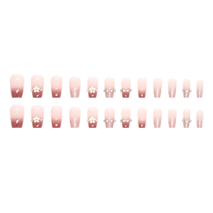 Pink ombre press-on nails set with 3D white flowers, pearls, and sparkling rhinestones