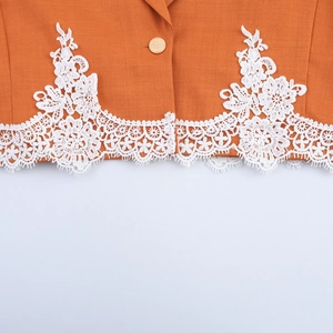 Elegant orange cropped blazer for women with white lace trim and gold button detail
