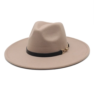 Detail of beige wool fedora featuring a black leather band and gold metal buckle