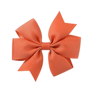 Bright orange grosgrain ribbon bow with swallowtail cut on white background