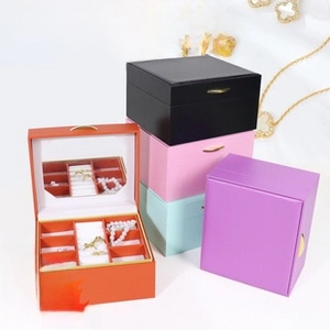 Multi-compartment faux leather jewelry box with mirror and gold handle detail