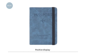 Close-up of blue RFID passport wallet with elastic strap and engraved travel icon