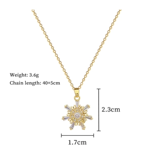 Detail showing snowflake pendant dimensions 2.3cm by 1.7cm on gold stainless steel chain