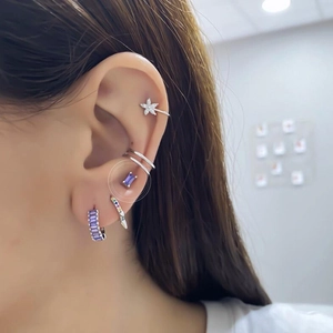 S925 silver studs featuring emerald-cut purple zircon stones shown on a female model