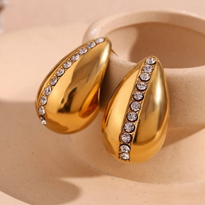 Macro shot of 18K gold plated teardrop stud earrings with pavé white rhinestones