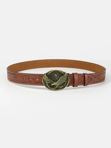 Close-up of brown embossed leather belt with a vintage bronze eagle buckle on white background