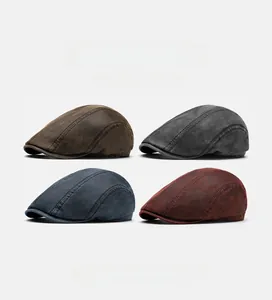 Detail of four vintage beret colors showing the stitched texture and worn-in fabric look