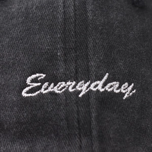 Washed cotton baseball cap in black with white 'Everyday' cursive embroidery detail